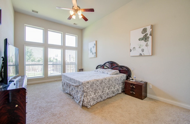 bedroom featuring ceiling fan and light colored carpet