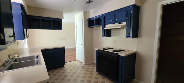 kitchen with light countertops, electric range, a sink, and under cabinet range hood