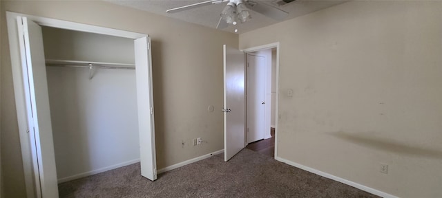 unfurnished bedroom featuring carpet floors, ceiling fan, and a closet