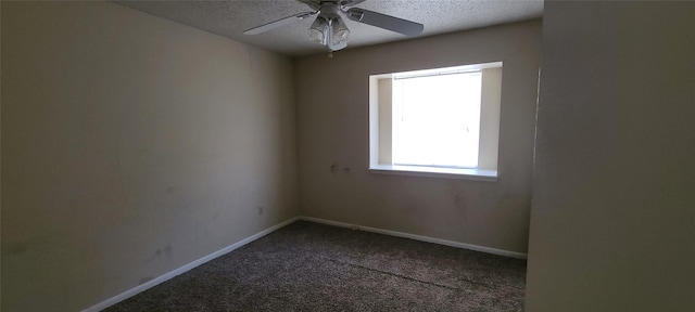 carpeted empty room with a textured ceiling, ceiling fan, and baseboards