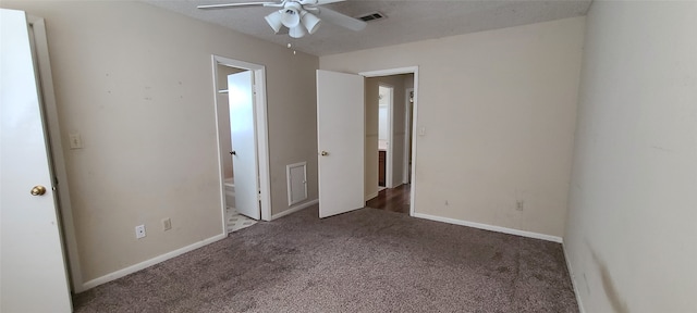 unfurnished bedroom featuring carpet floors, ceiling fan, and ensuite bathroom