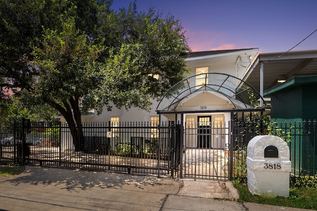 view of front facade with a gate and a fenced front yard