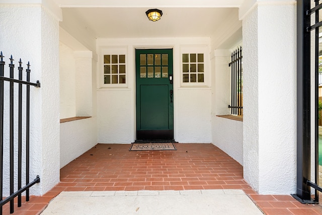 view of exterior entry featuring stucco siding