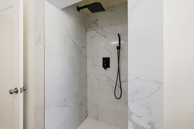 bathroom with a tile shower