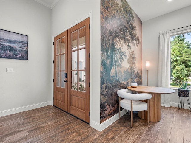 foyer entrance featuring wood finished floors and baseboards