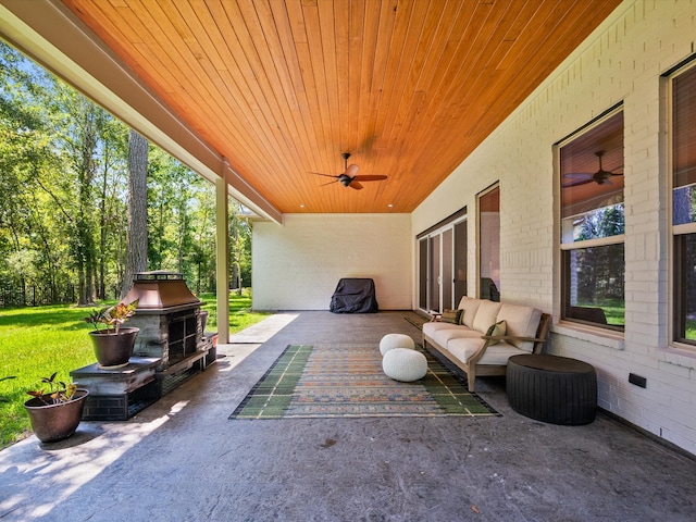 view of patio / terrace featuring ceiling fan and an outdoor living space