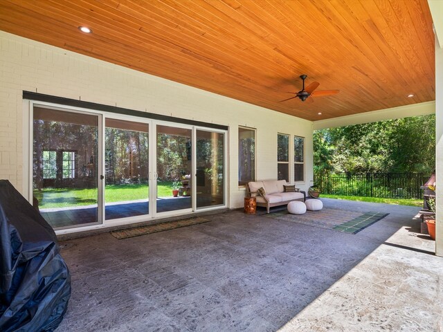 view of patio / terrace featuring ceiling fan and fence