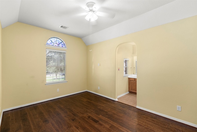 unfurnished room with hardwood / wood-style flooring, vaulted ceiling, and ceiling fan