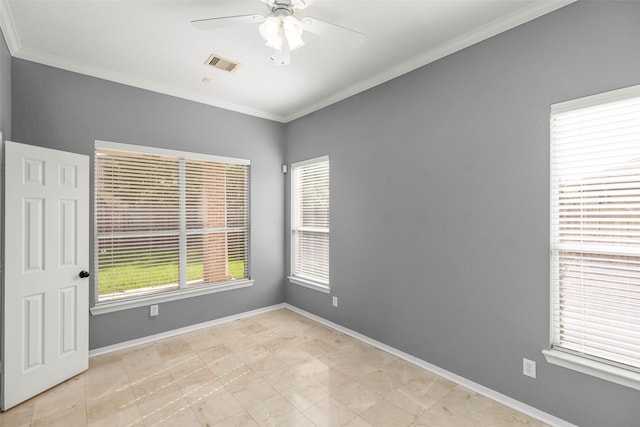 spare room featuring ceiling fan, light tile patterned floors, and crown molding