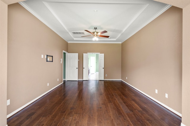 unfurnished room with ceiling fan, crown molding, a tray ceiling, and wood-type flooring