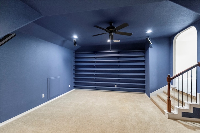 interior space featuring ceiling fan