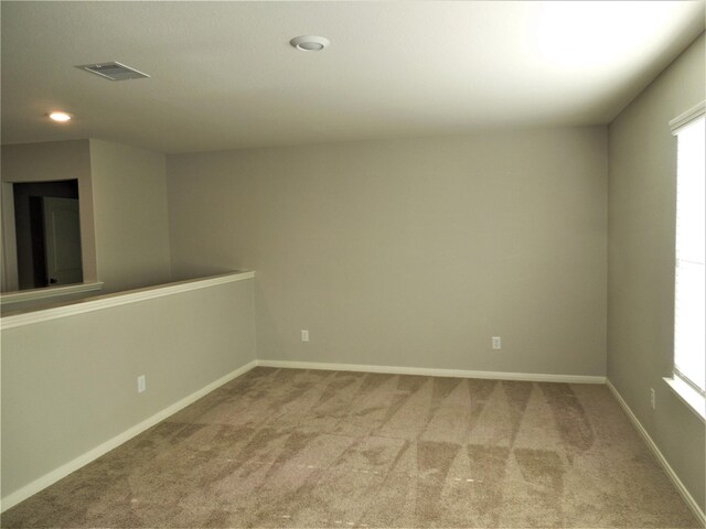 unfurnished room with carpet flooring