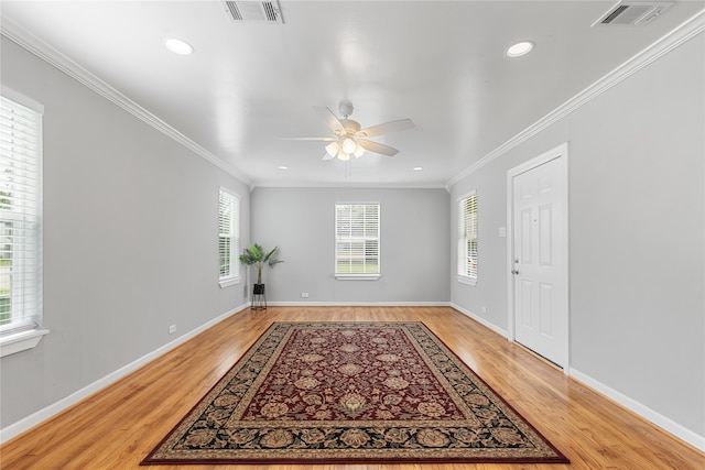 foyer featuring ceiling fan, plenty of natural light, and light hardwood / wood-style flooring