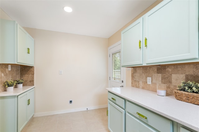 kitchen with backsplash and light tile patterned floors