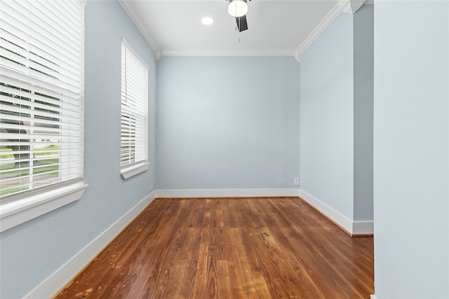 empty room featuring ceiling fan, ornamental molding, and wood-type flooring