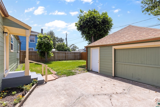 garage featuring a lawn