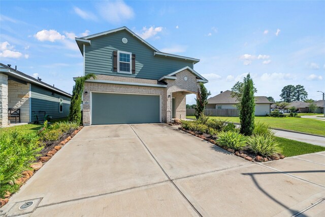 front of property with a front lawn and a garage