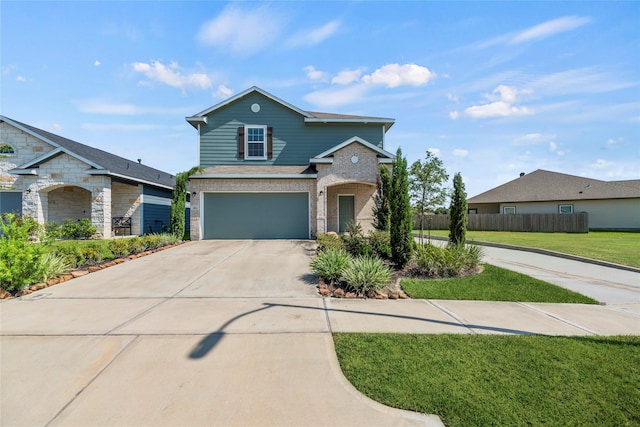 traditional home with a garage, concrete driveway, fence, a front lawn, and brick siding