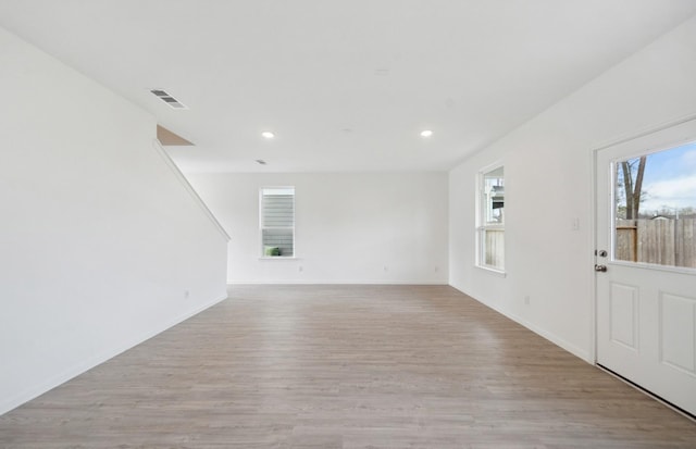 unfurnished living room featuring light hardwood / wood-style floors