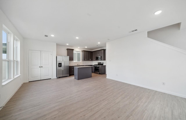 unfurnished living room featuring light wood-type flooring