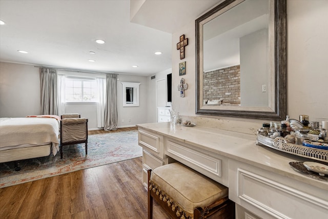 bathroom featuring hardwood / wood-style floors and vanity