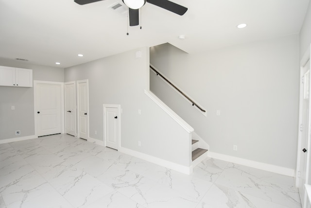 interior space with ceiling fan and light tile patterned flooring