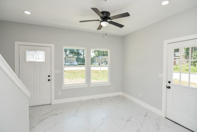 entrance foyer with light tile patterned floors and ceiling fan