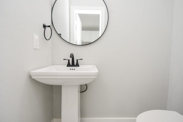 bathroom with sink and toilet