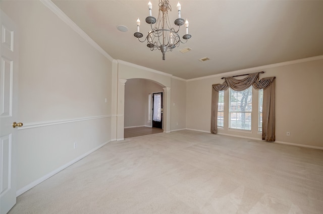 carpeted spare room with crown molding and a notable chandelier