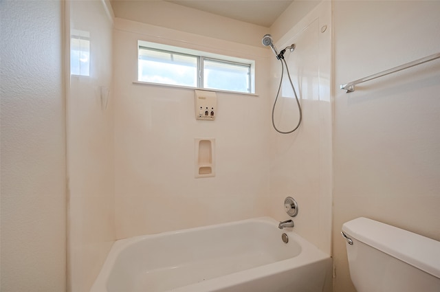 bathroom featuring toilet and tub / shower combination