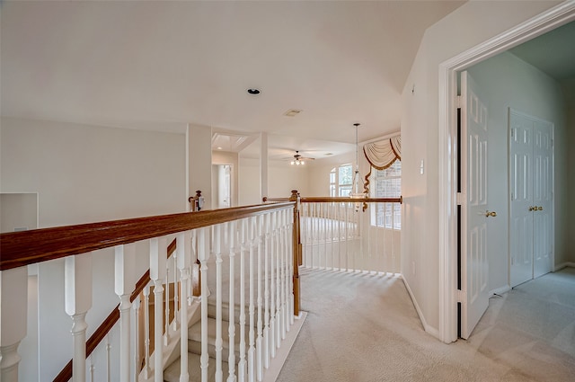 hallway featuring carpet