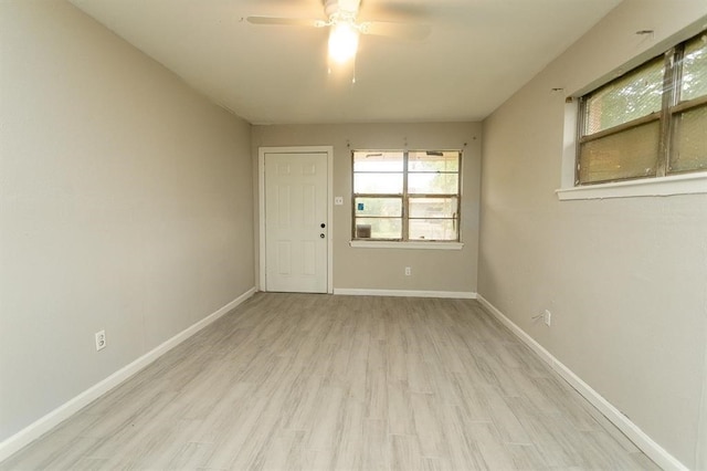 empty room featuring light hardwood / wood-style flooring and ceiling fan