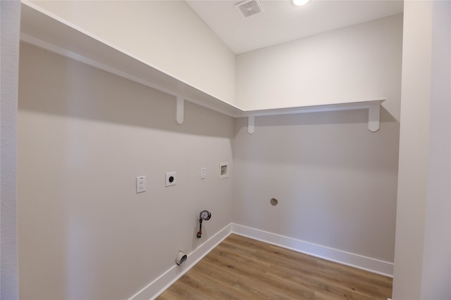 laundry room featuring hookup for a washing machine, hookup for a gas dryer, hardwood / wood-style floors, and hookup for an electric dryer