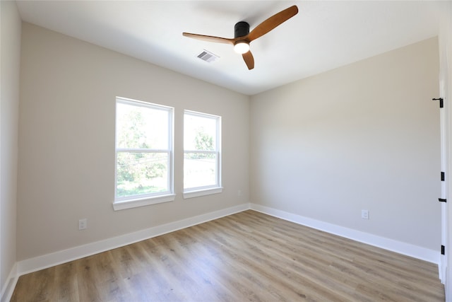 spare room featuring ceiling fan and light hardwood / wood-style floors