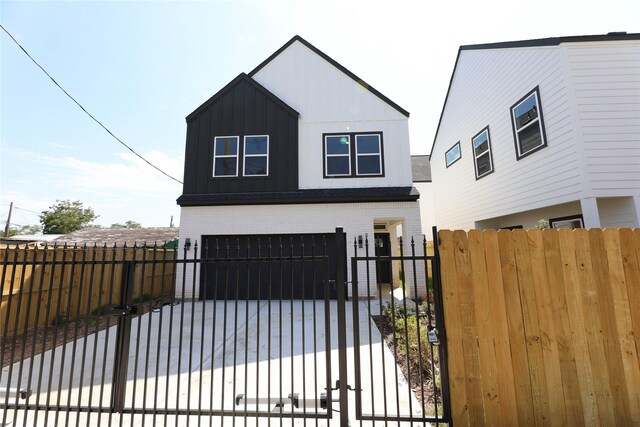 view of gate with a garage