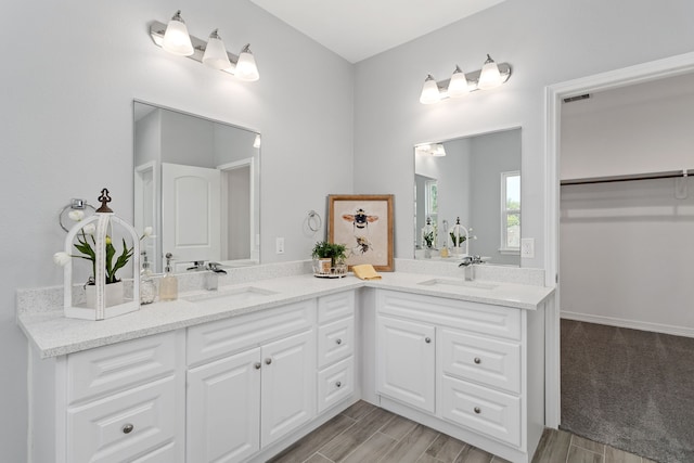 bathroom featuring vanity and hardwood / wood-style flooring