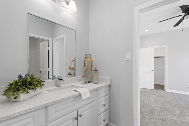 bathroom with ceiling fan and vanity