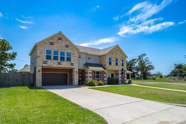 view of front of house featuring a front yard and a garage