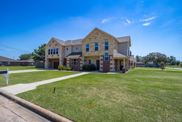 view of front of home with a garage and a front yard