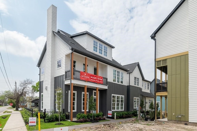 view of front of house with a balcony