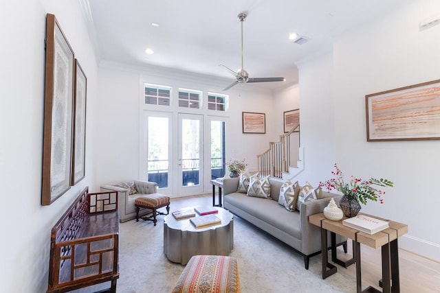 living room featuring ceiling fan, french doors, and crown molding