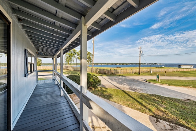 wooden deck with a lawn