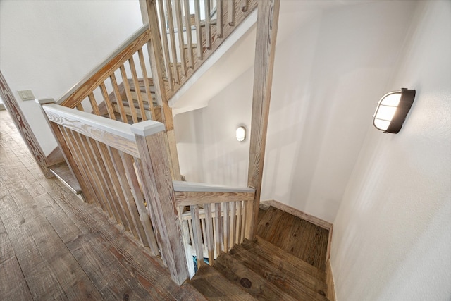 stairs with hardwood / wood-style flooring