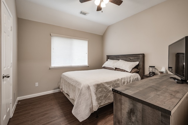 bedroom featuring vaulted ceiling, dark wood-type flooring, and ceiling fan