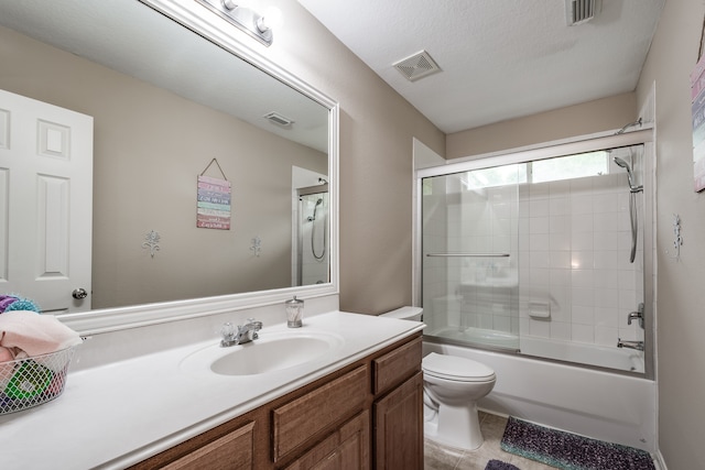 full bathroom with toilet, a textured ceiling, combined bath / shower with glass door, and vanity