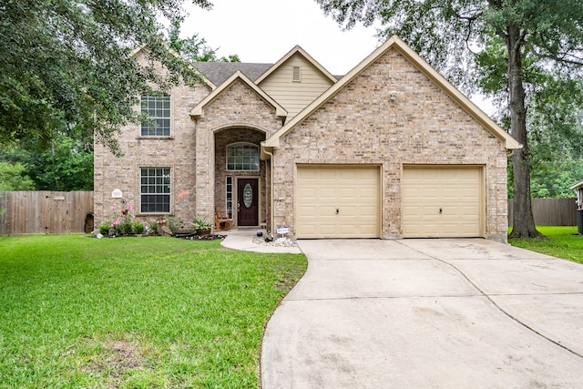 view of front of property featuring a garage and a front yard