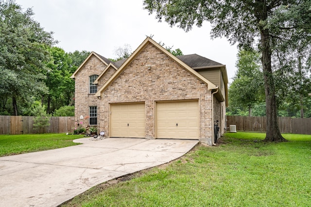 view of front facade with a garage and a front lawn