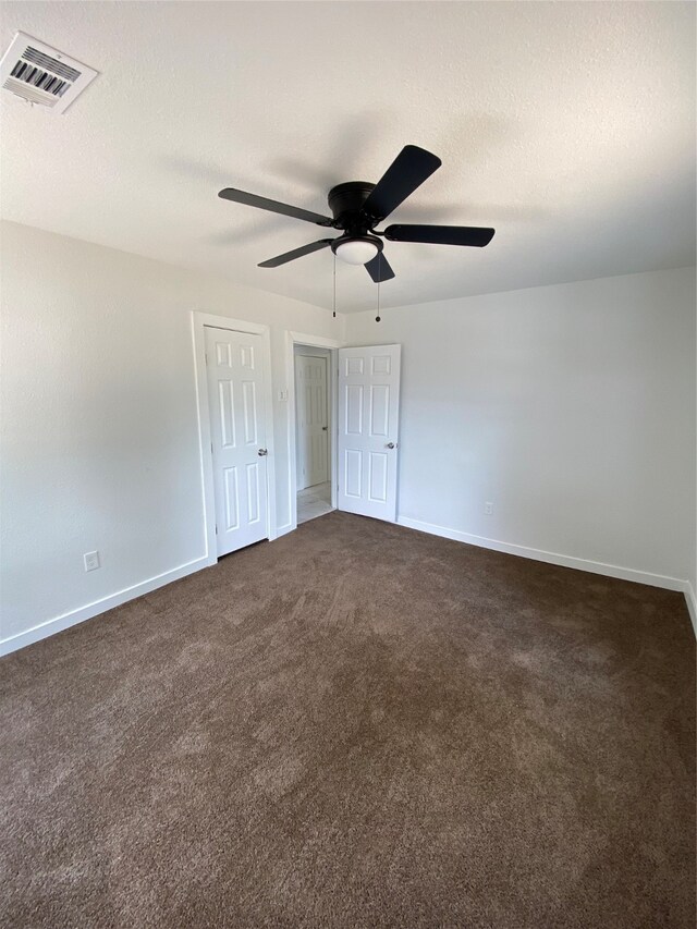 interior space with ceiling fan