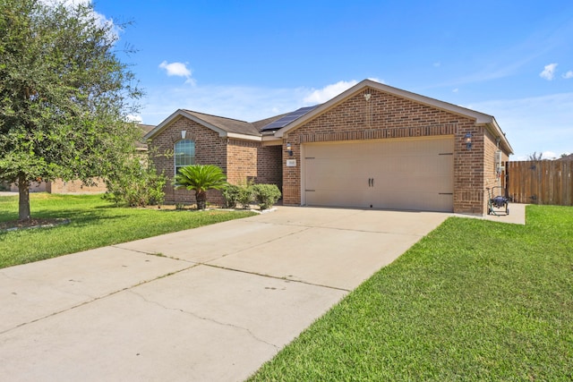 ranch-style house featuring a garage and a front lawn