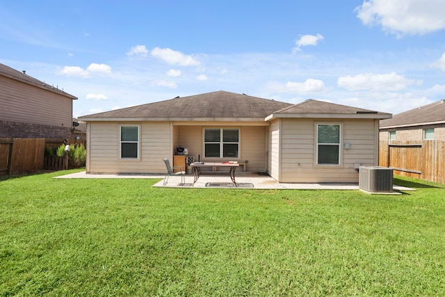 back of house with a patio, central AC, and a lawn